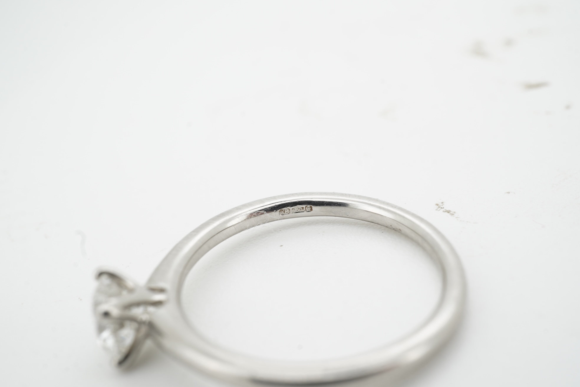 A diamond ring, claw-set with a brilliant-cut diamond weighing approximately 0.52 carats, mounted in platinum, size L1/2, British hallmarks, gross weight approximately 3 grams